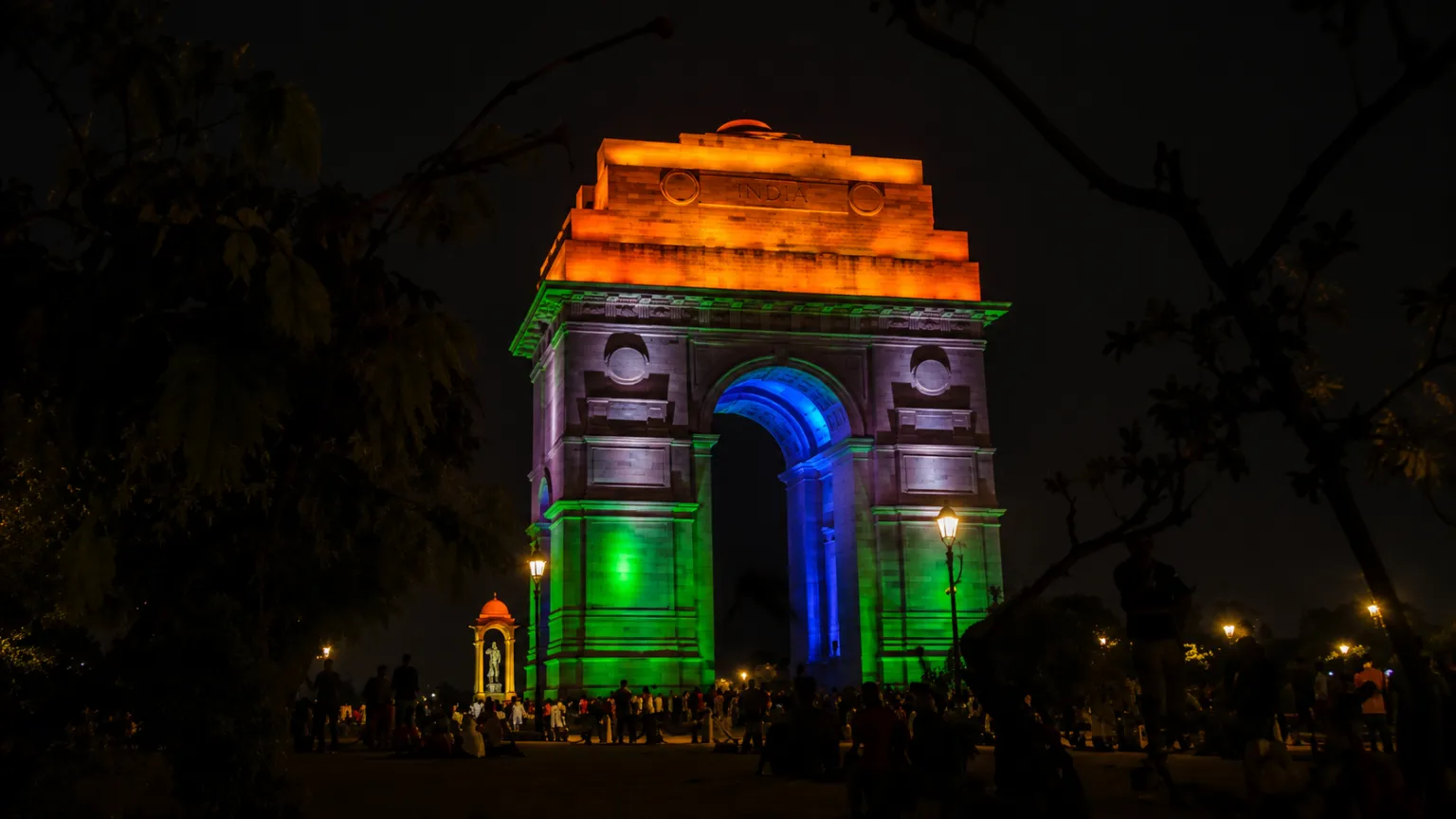 India Gate beautifully illuminated in the colors of the Indian tricolor during the evening in New Delhi.