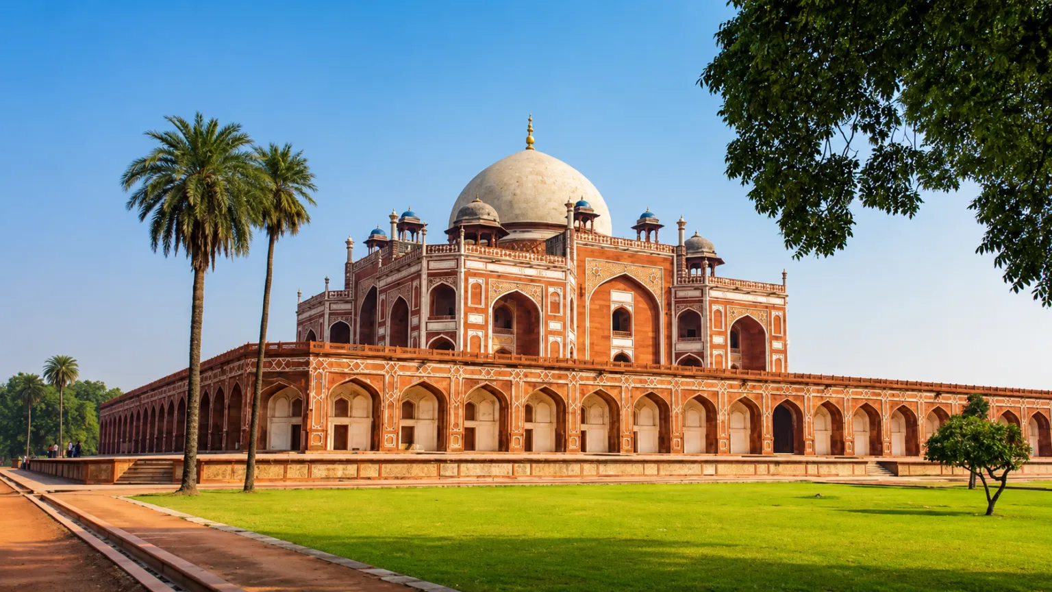 Beautiful view of Humayun's Tomb surrounded by lush gardens in New Delhi.