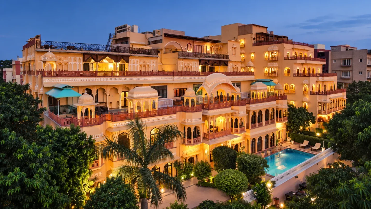 Exterior view of Shahpura House Jaipur with traditional Rajput architecture, balconies, and illuminated façade.