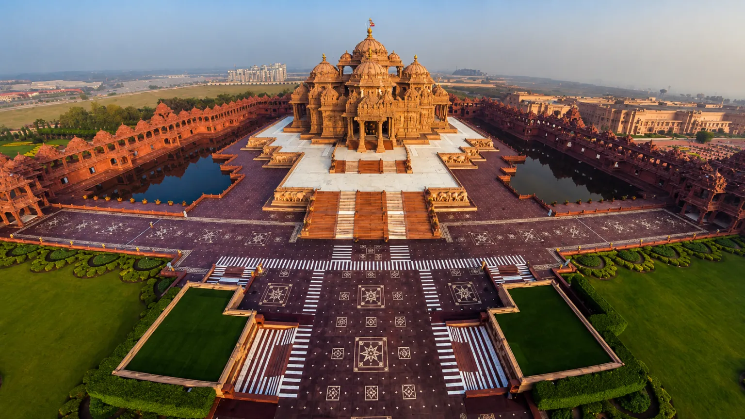 Aerial view of the magnificent Akshardham Temple showcasing intricate carvings and grand temple architecture.