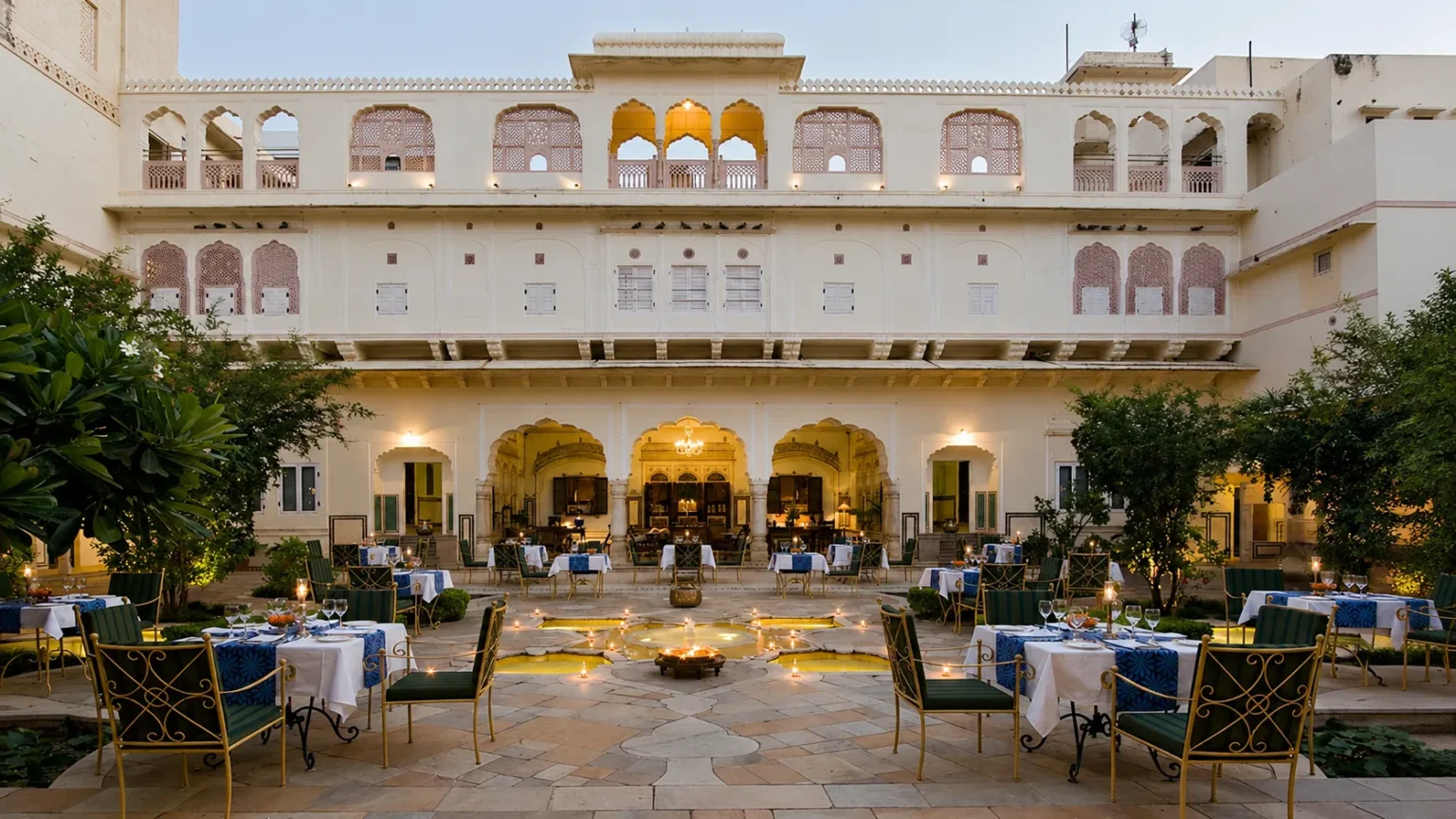 Elegant heritage suite at Samode Haveli Jaipur featuring traditional blue artwork, luxury furnishings, and classic Rajasthani décor.