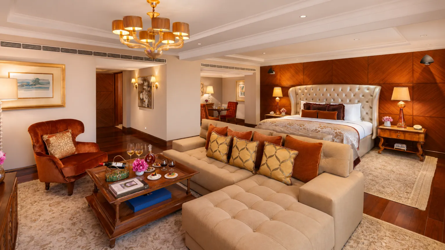 Grand lobby at Taj Palace New Delhi featuring artistic ceiling murals, luxury seating, elegant lighting, and sophisticated interiors.