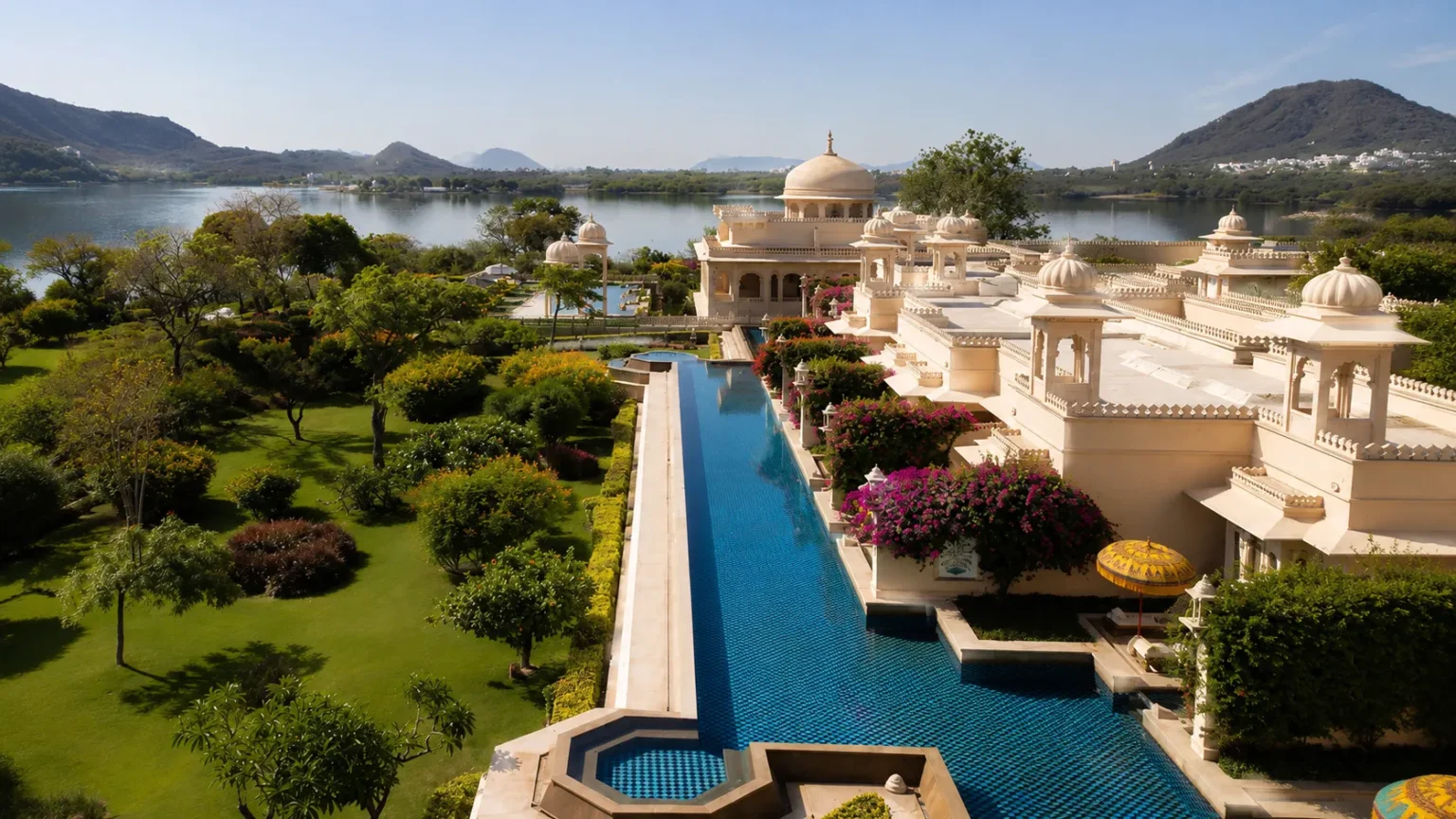 Elegant heritage suite at Shiv Niwas Palace overlooking Lake Pichola with royal interiors and handcrafted furnishings.