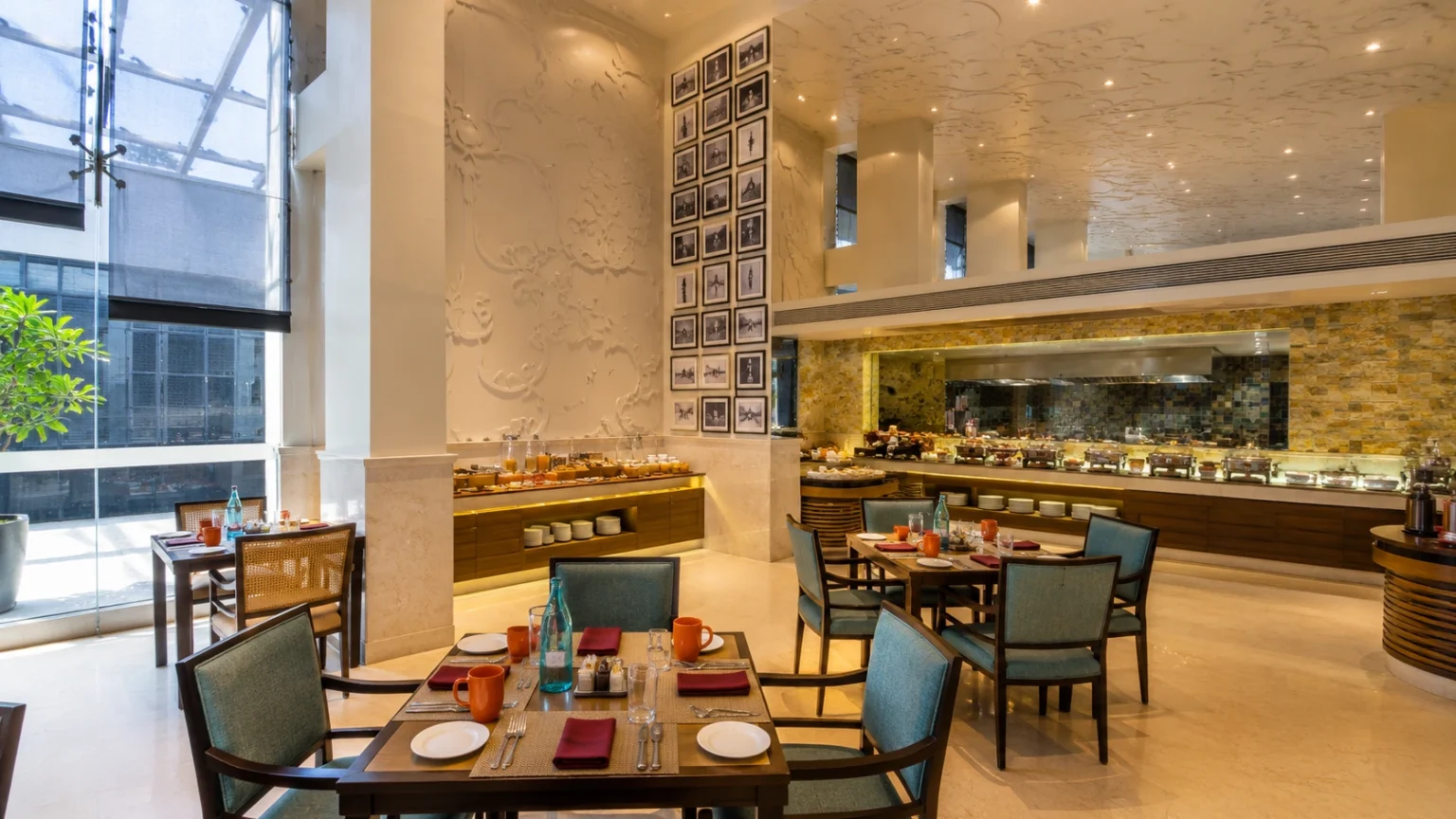 Spacious restaurant and breakfast buffet area at Novotel Goa Resort & Spa with modern interiors and elegant dining.
