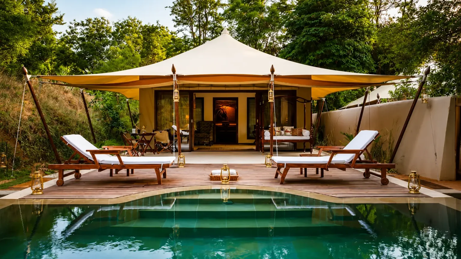 Luxury suite with a private outdoor Jacuzzi at Sher Bagh Ranthambore featuring elegant interiors and thatched roofing.