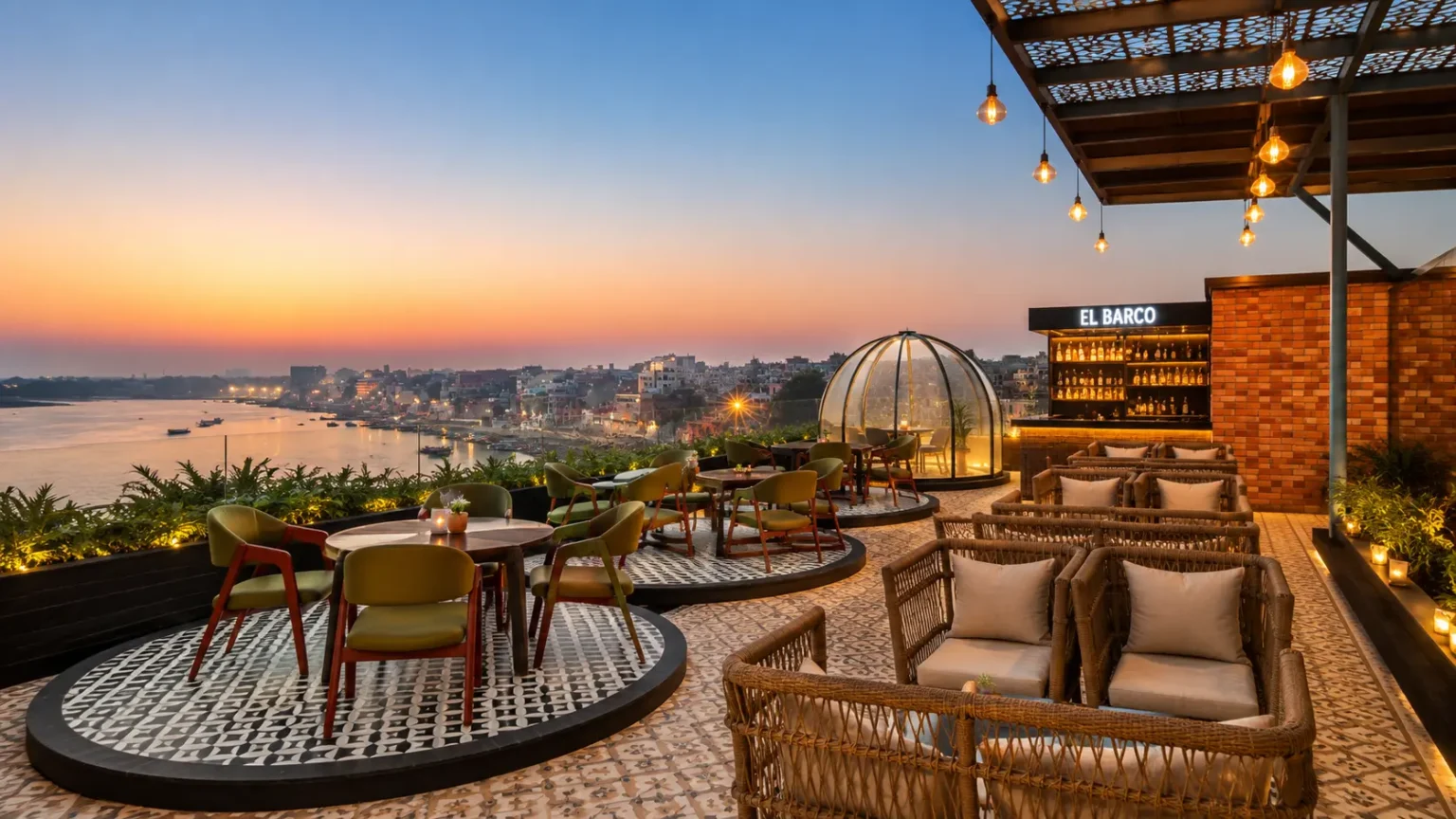 Rooftop restaurant at The Fern Residency Sarnath with elegant seating, sunset skyline, and outdoor dining experience.