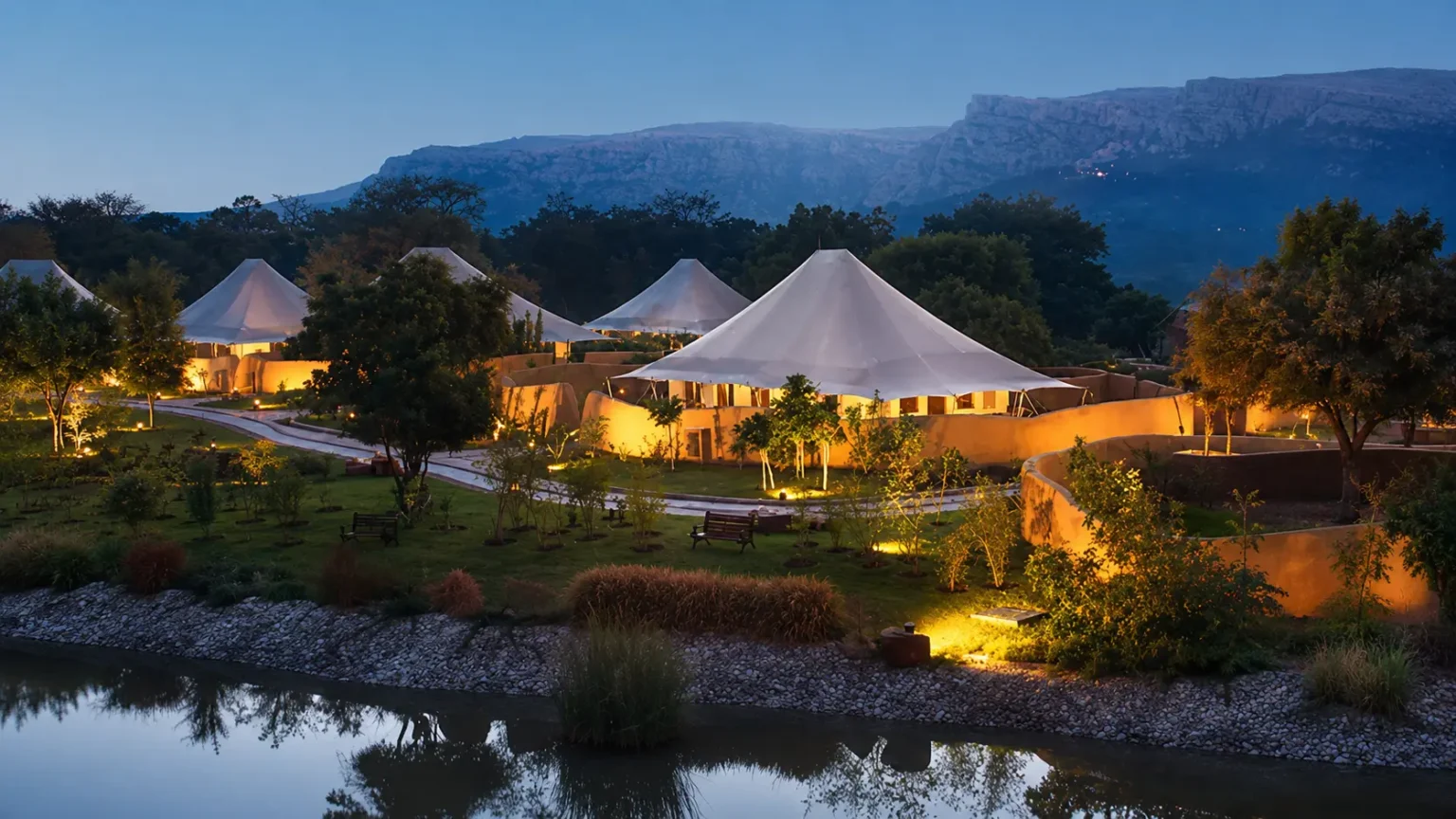 Luxury safari tent with a private swimming pool and wooden sun loungers at The Oberoi Vanyavilas Ranthambore.