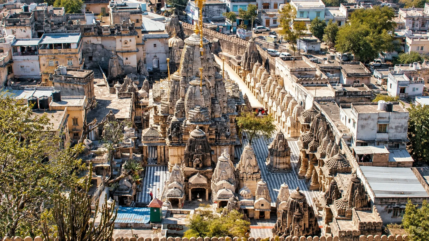 Aerial view of the ornate Kashi Vishwanath Temple complex surrounded by the historic streets and buildings of Varanasi